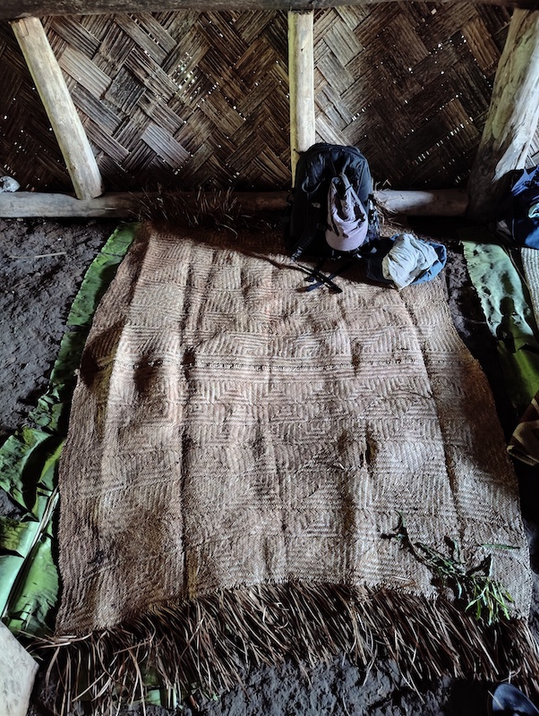 woven pandanus mat on the hard mud floor in the nakamal